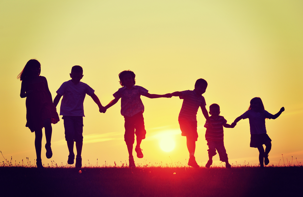 Happy,Children,Silhouettes,On,Summer,Meadow,Running,And,Jumping